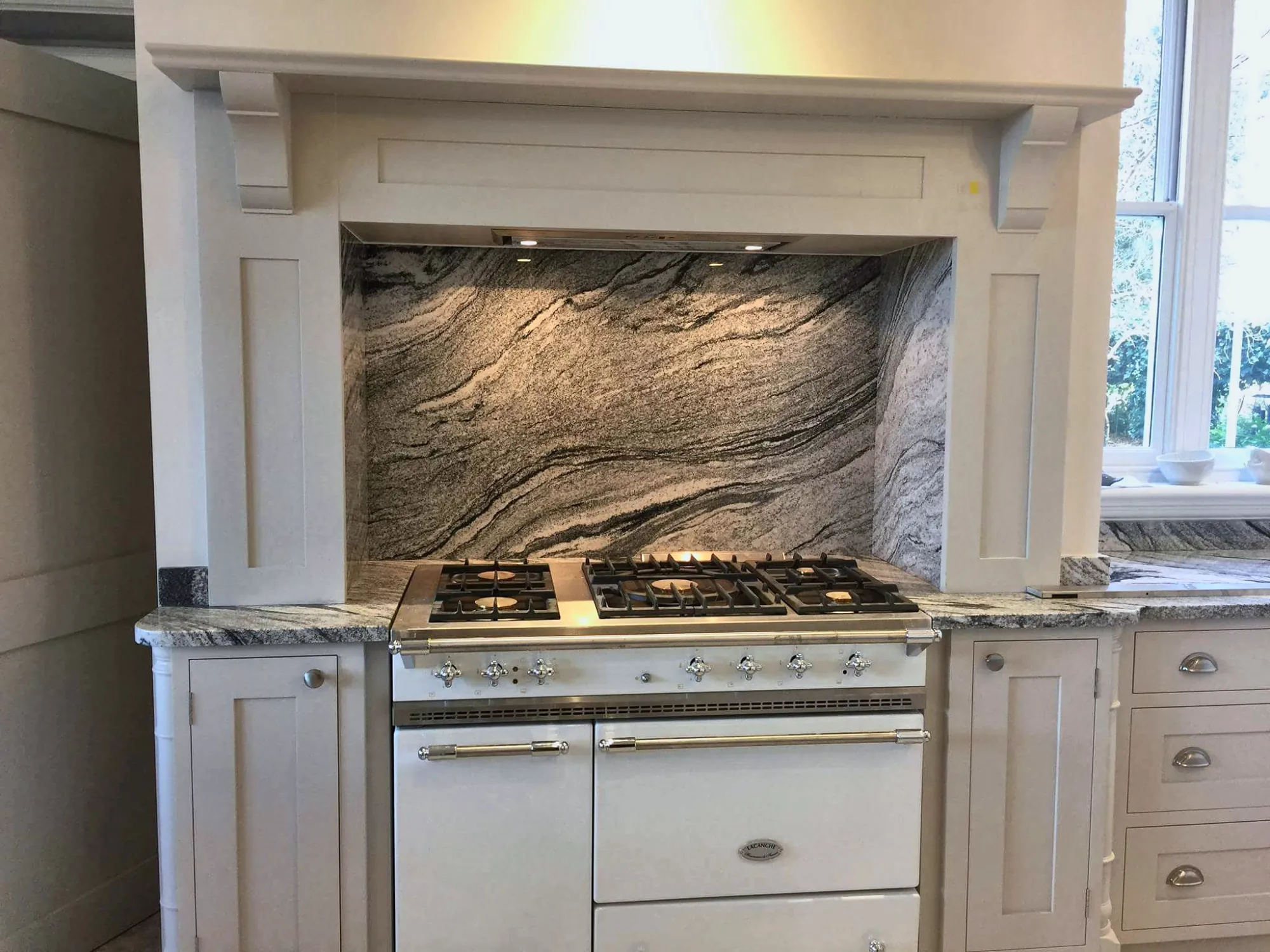 Range cooker set into a painted mantel
