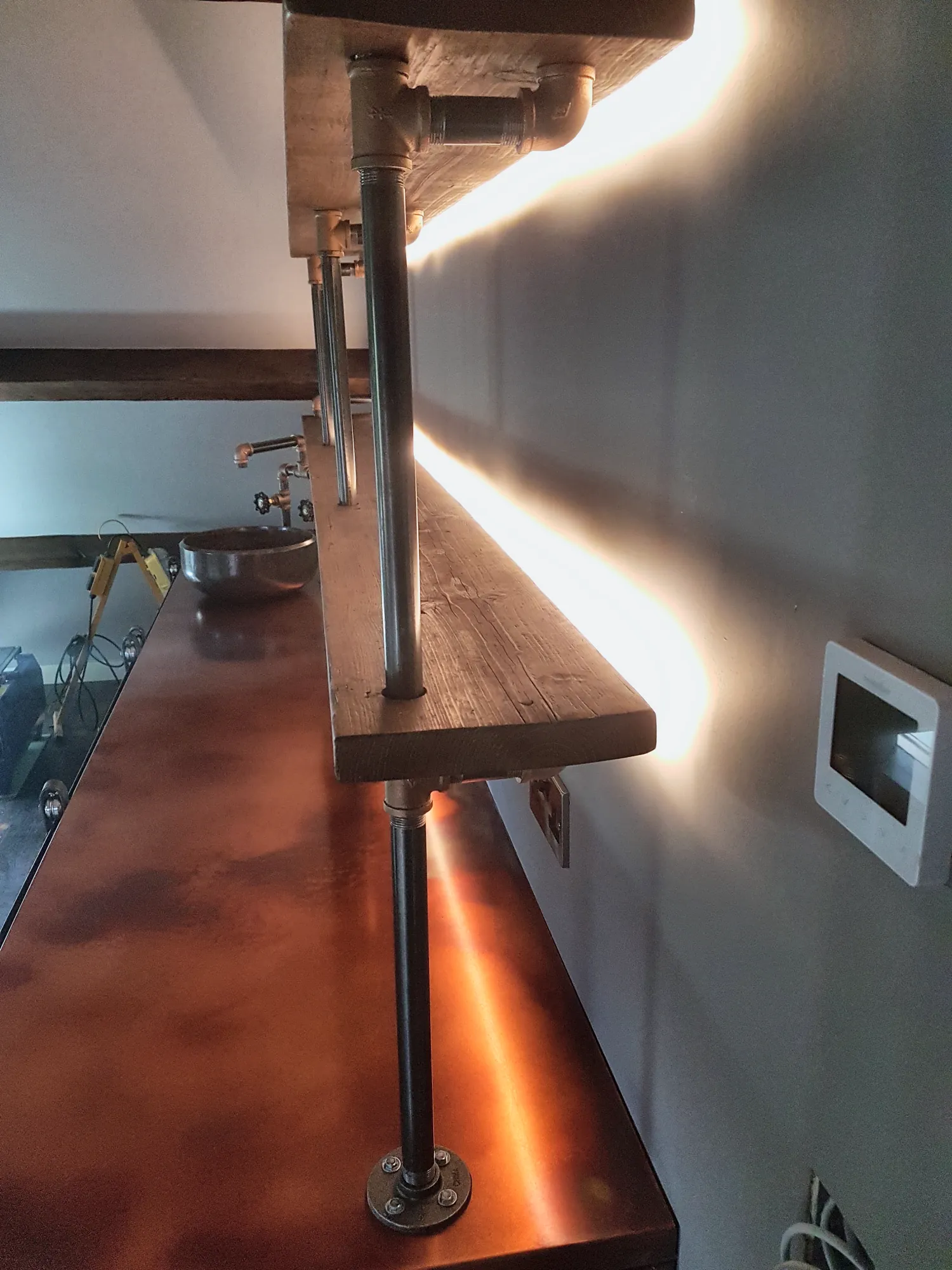 LED strips washing light along the shelves