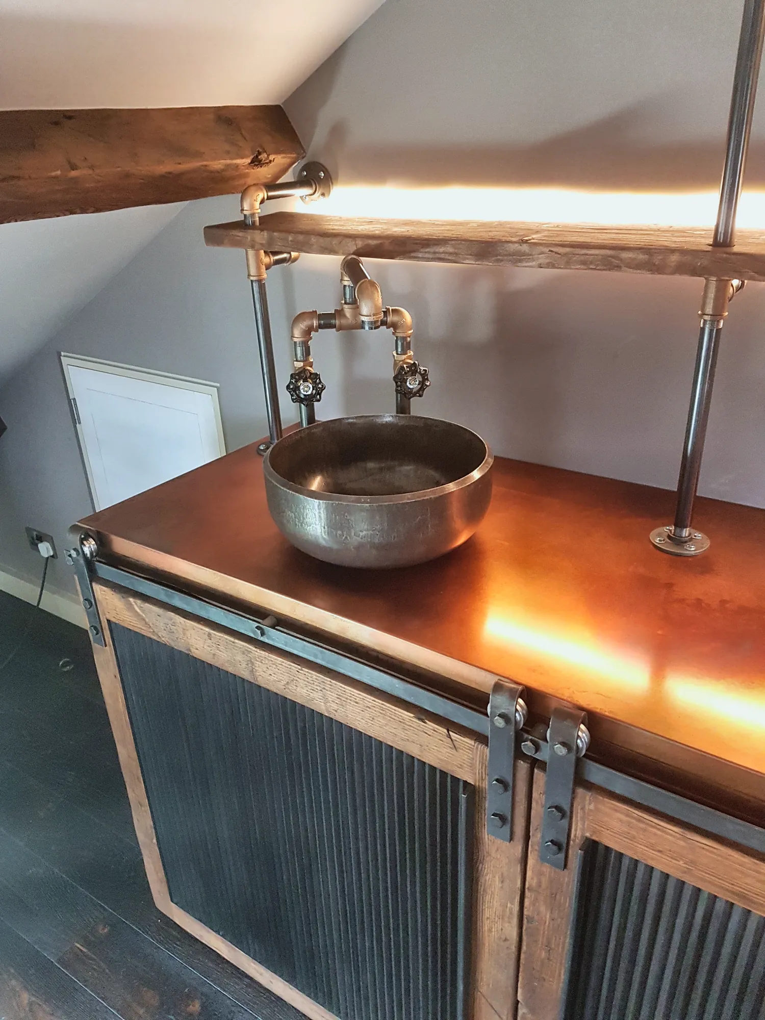 The vanity with its sliding corrugated doors