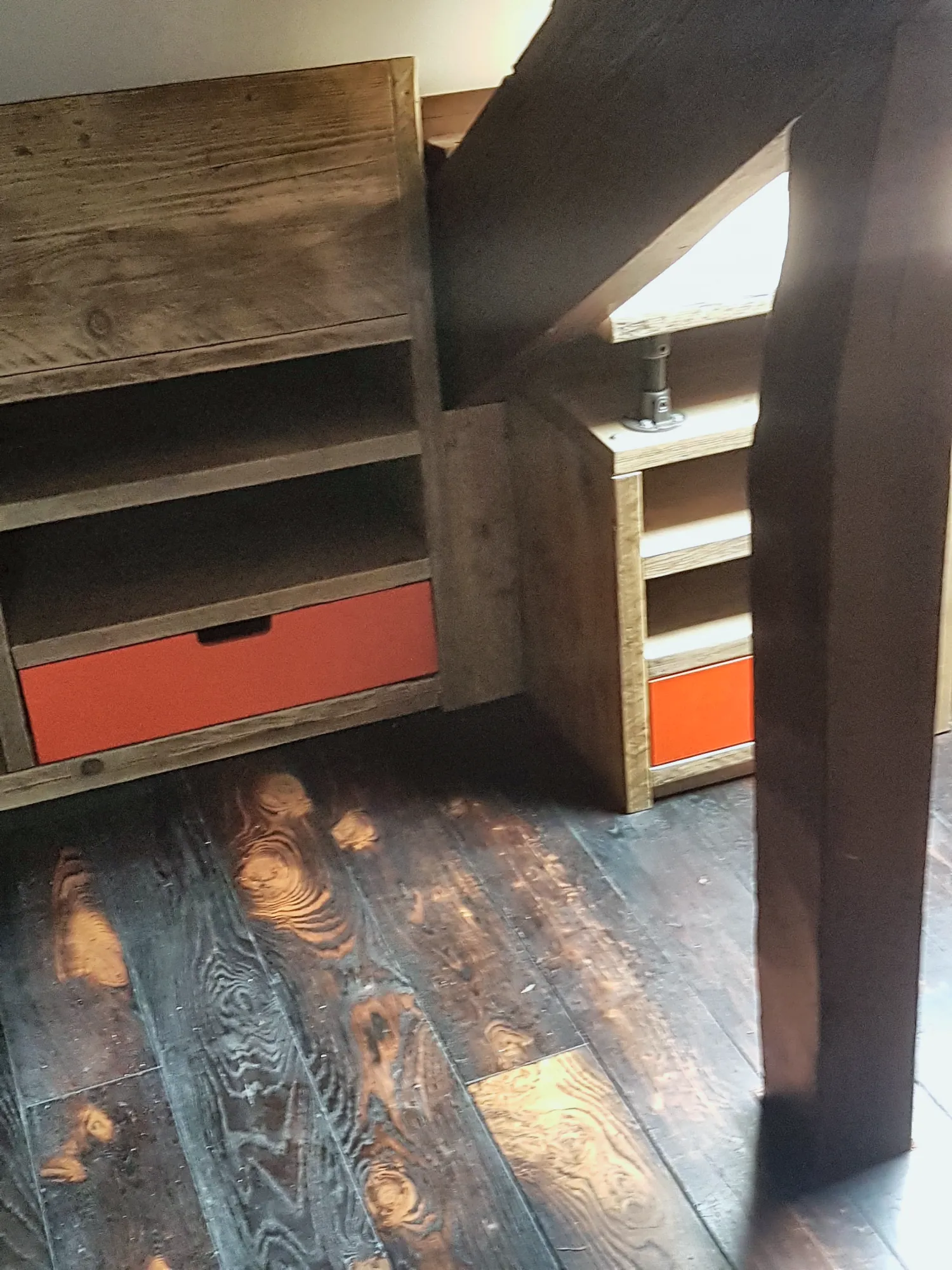 Matching attic storage with orange drawers