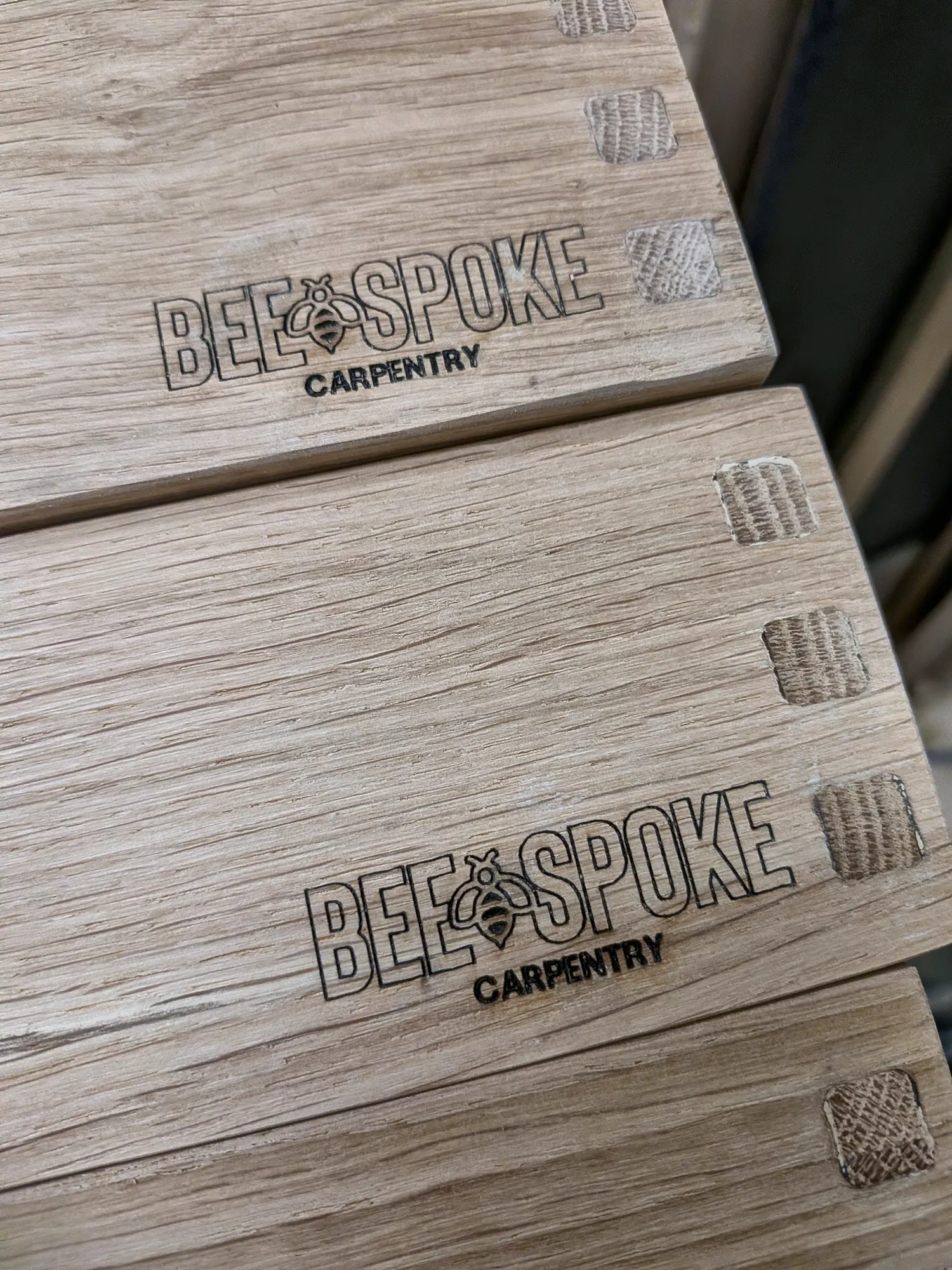 Dovetailed oak boxes engraved with the Beespoke mark