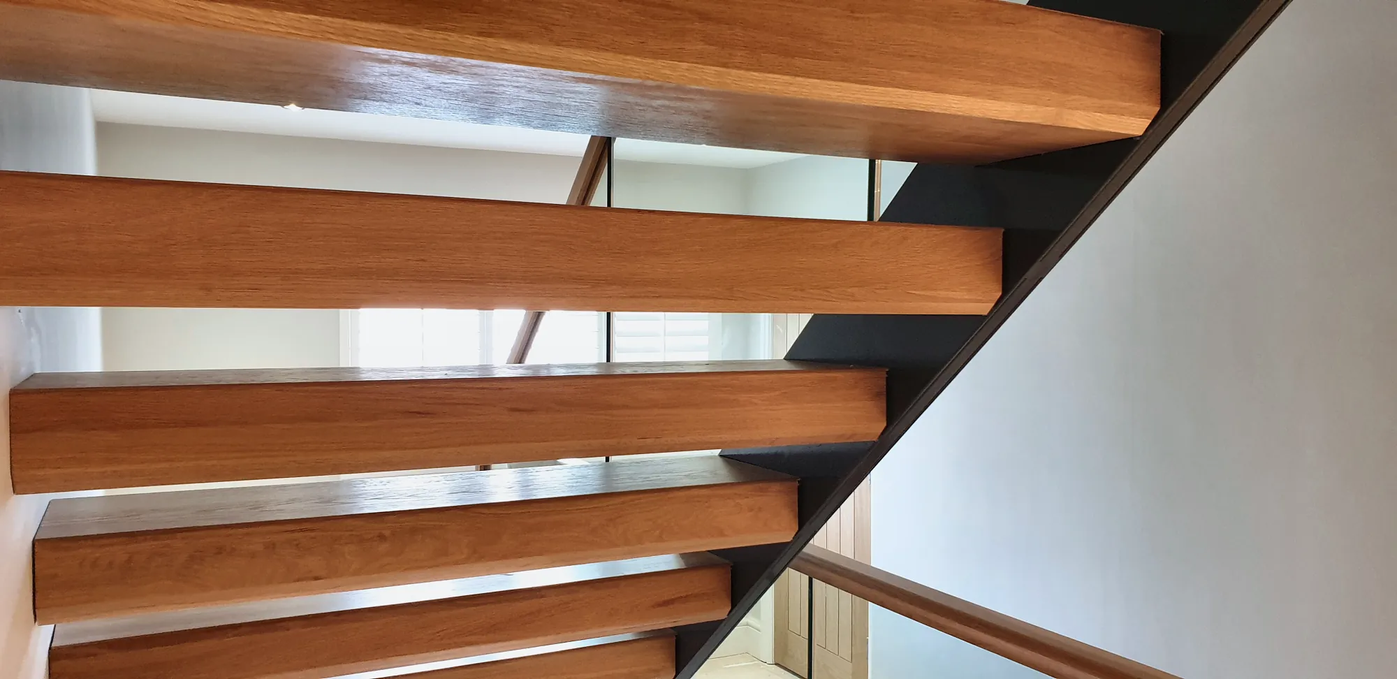 Cantilevered oak treads seen from below