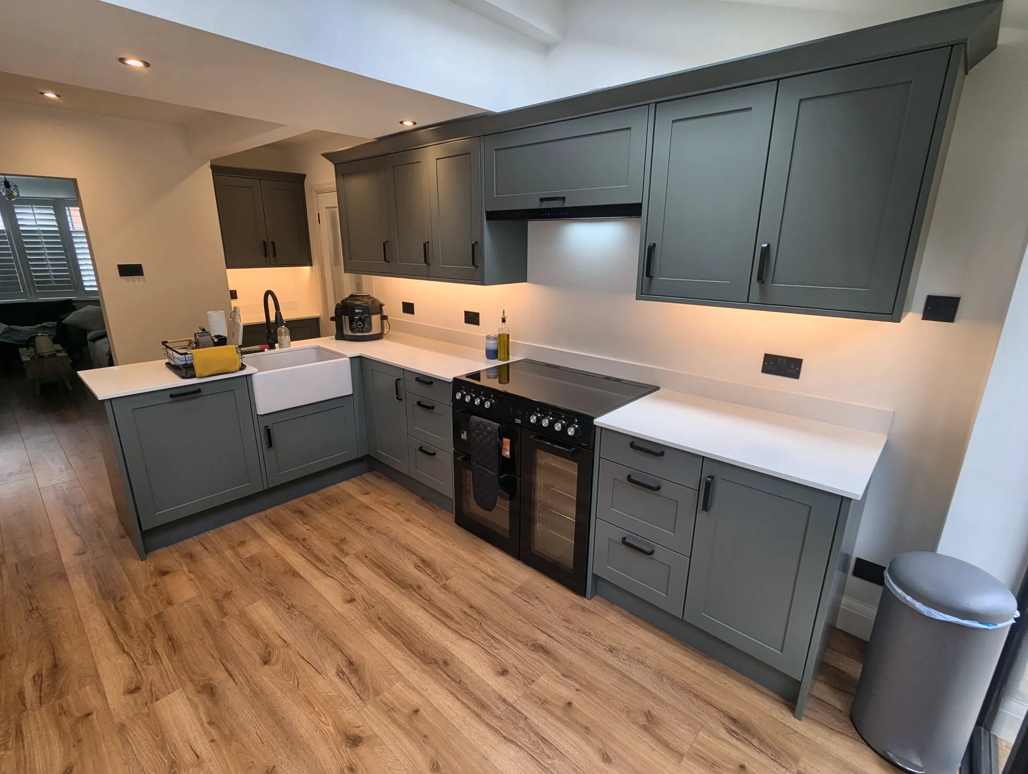 Under-cabinet lighting along the quartz worktop
