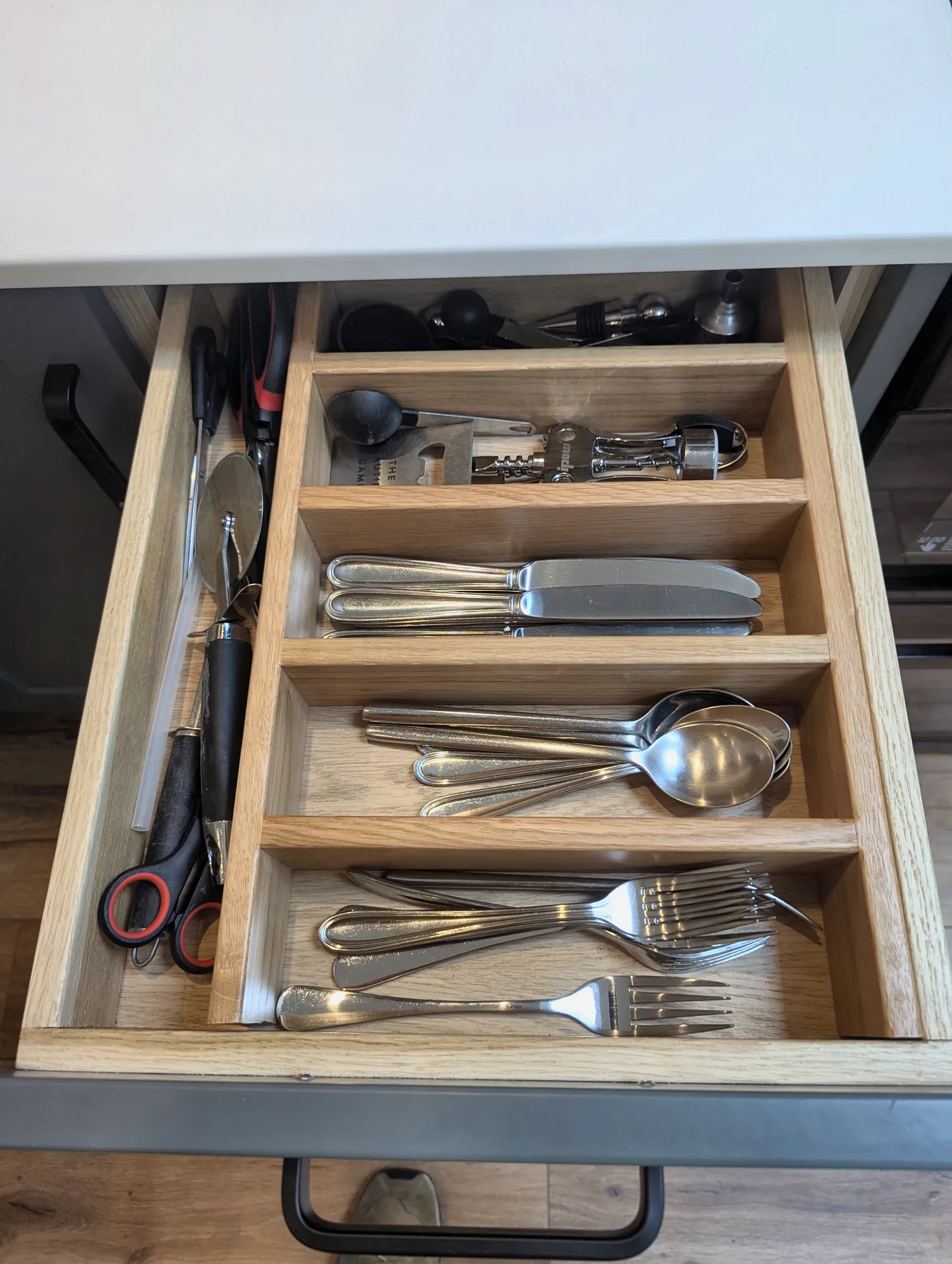 Oak cutlery insert in a soft-close drawer