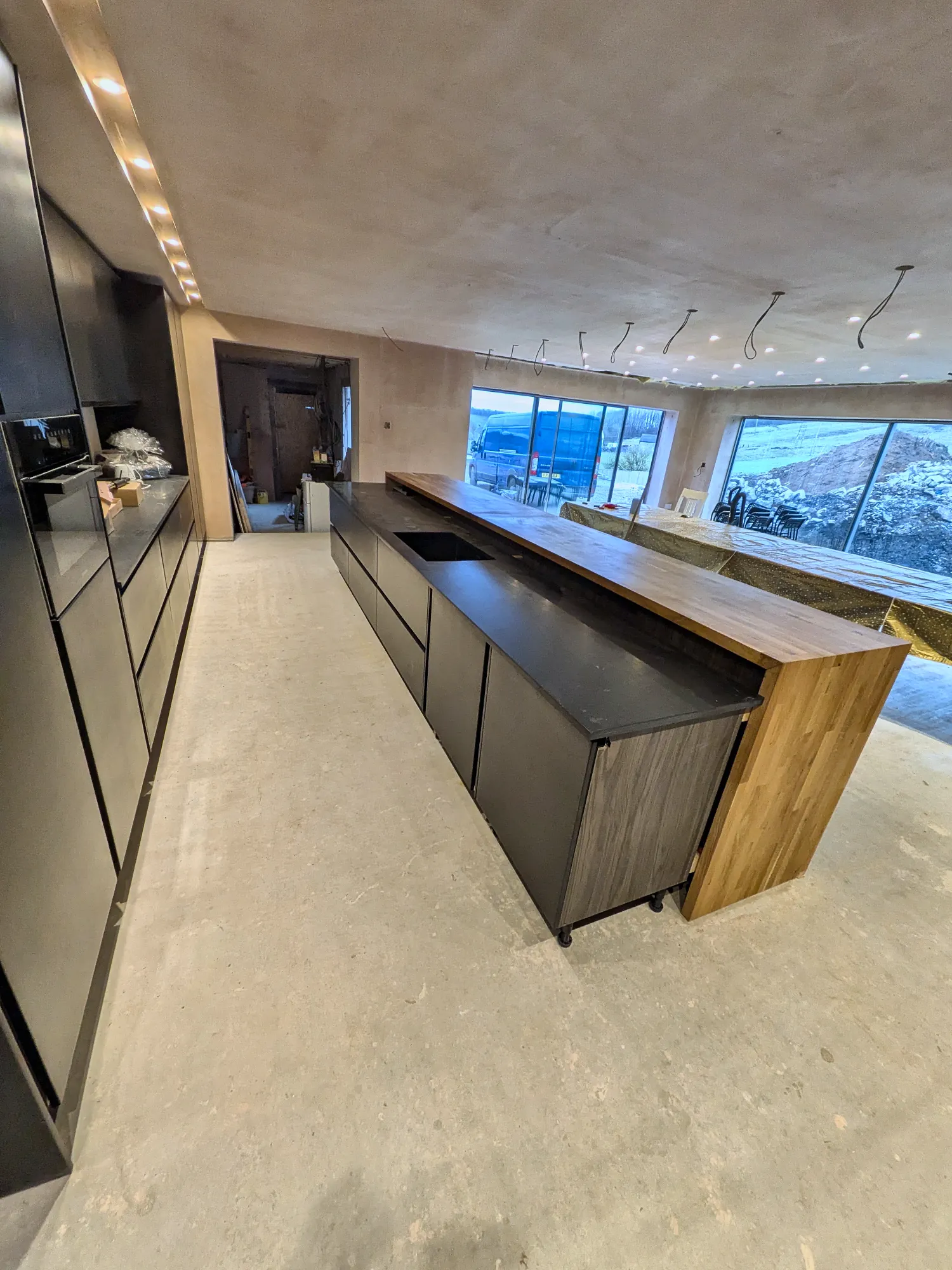 Tall handleless units running the length of the room