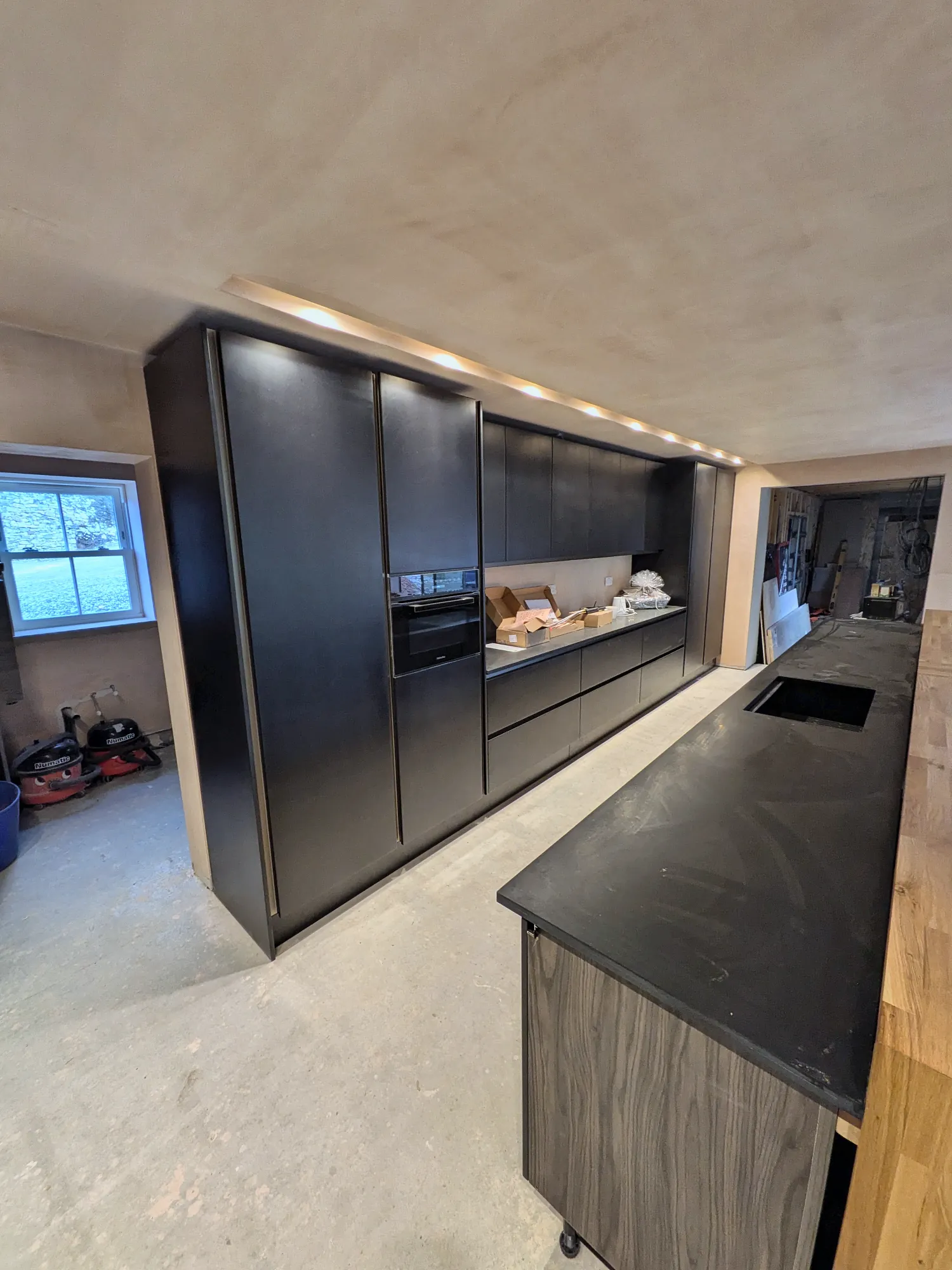 Black worktop and tall oven housing