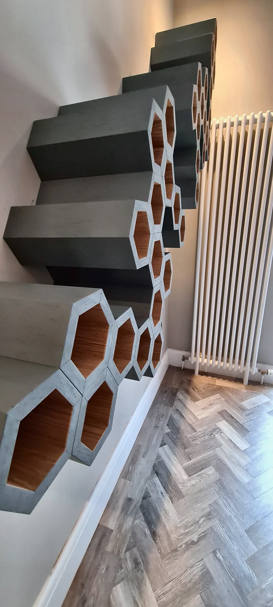 Honeycomb wine rack running up the wall