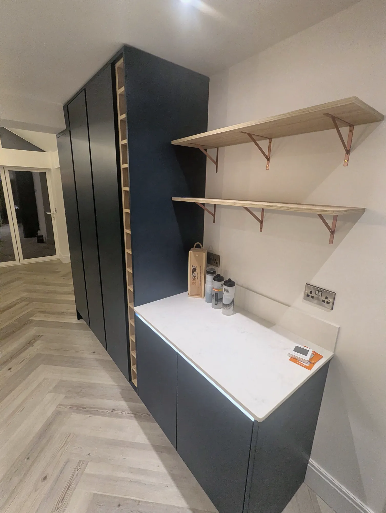 Navy base units with oak shelving above