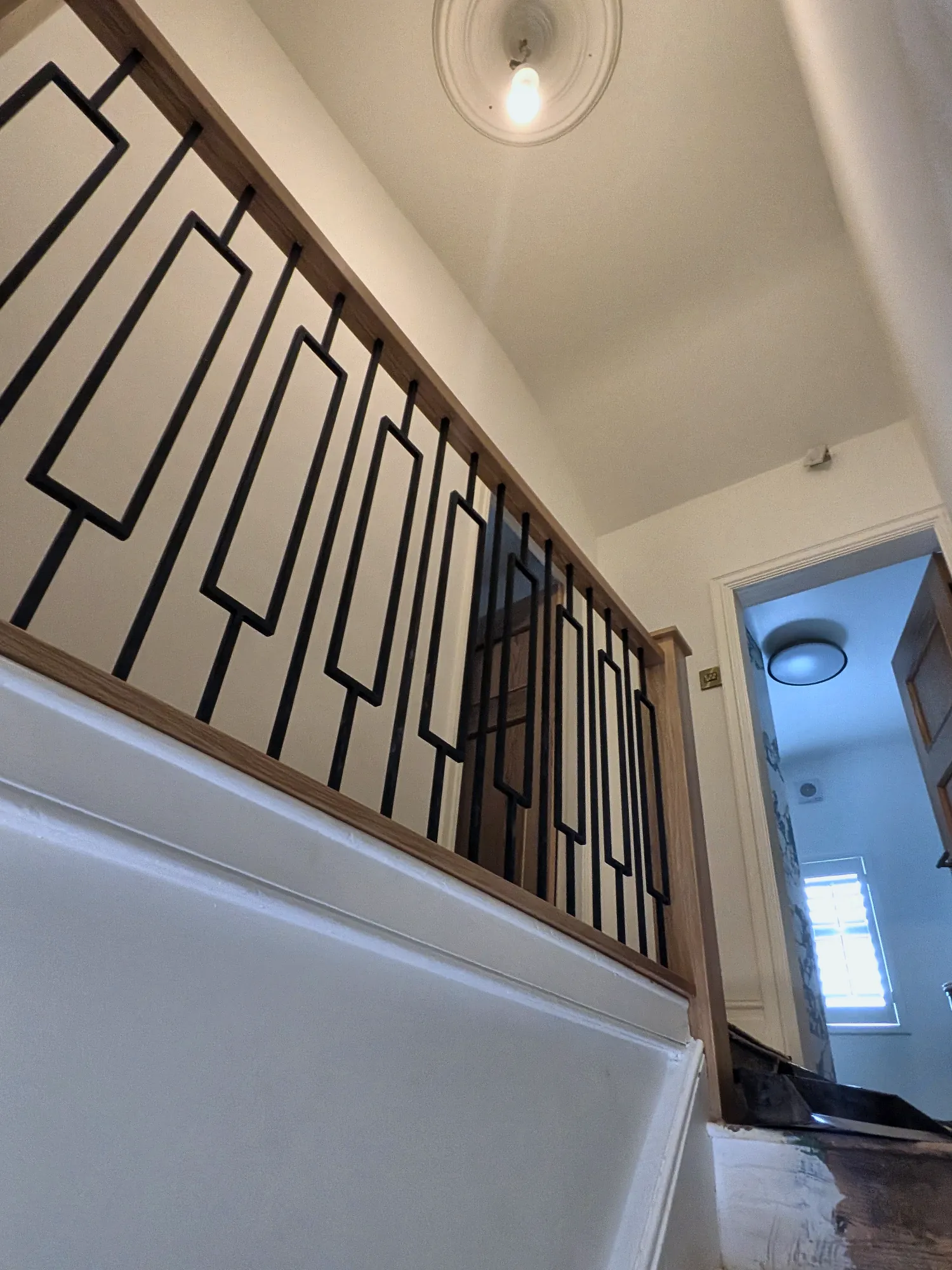 The geometric balustrade seen from the landing