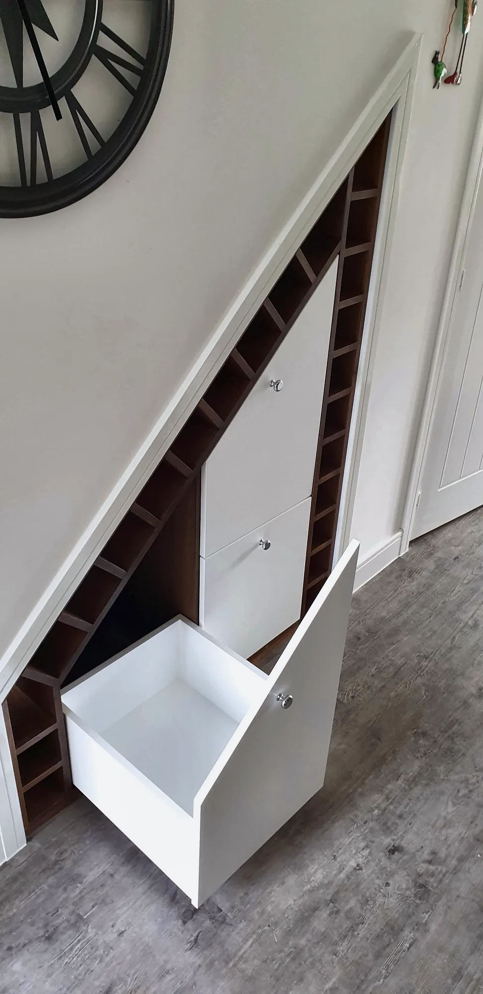 Deep pull-out drawer beneath the stairs